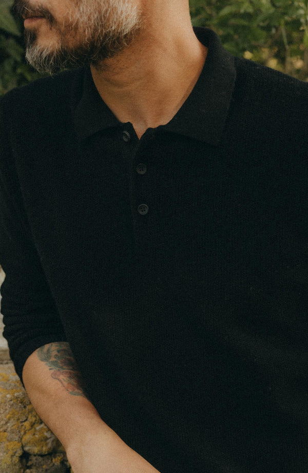 fit model showing off the collar on The Newton Sweater Polo in Midnight Merino