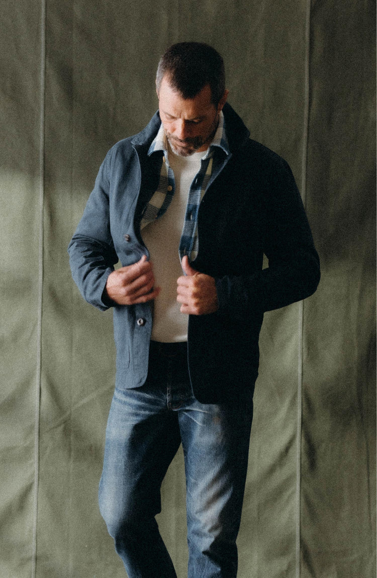 fit model buttoning up The Ojai Jacket in Organic Navy Foundation Twill