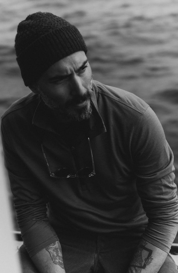fit model posing in The Ridgeline Merino Half Zip in Field Olive