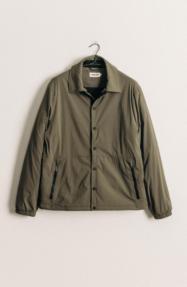 editorial image of The Ridgeline Overshirt in Fatigue Olive on grass
