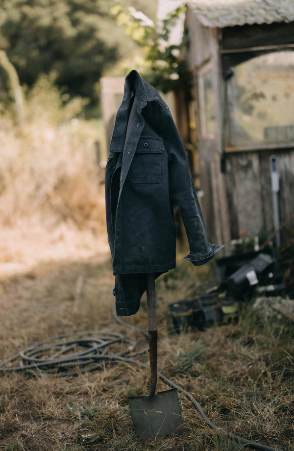 editorial image of The Shop Shirt in Navy Chipped Canvas on some rocks