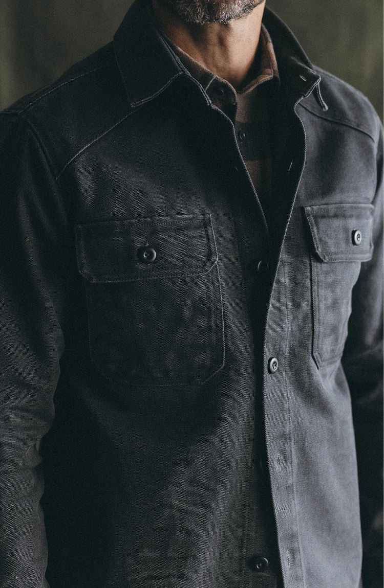 fit model gardening wearing The Shop Shirt in Coal Chipped Canvas