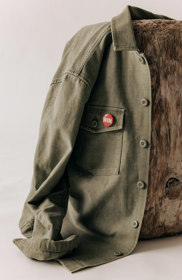 fit model with The Surplus Shirt in Field Olive Reverse Sateen over his shoulder