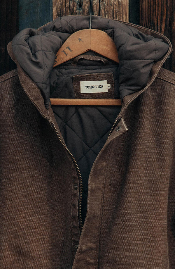 editorial image of The Workhorse Hoodie in Aged Penny Chipped Canvas hanging