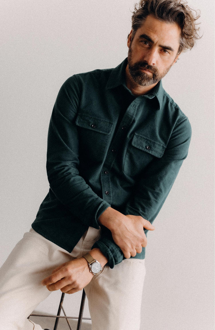fit model sitting wearing The Yosemite Shirt in Dark Forest