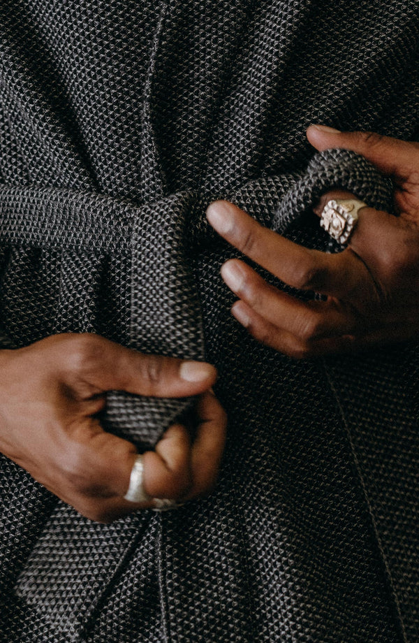 fit model tying The Apres Robe in Charcoal Sashiko