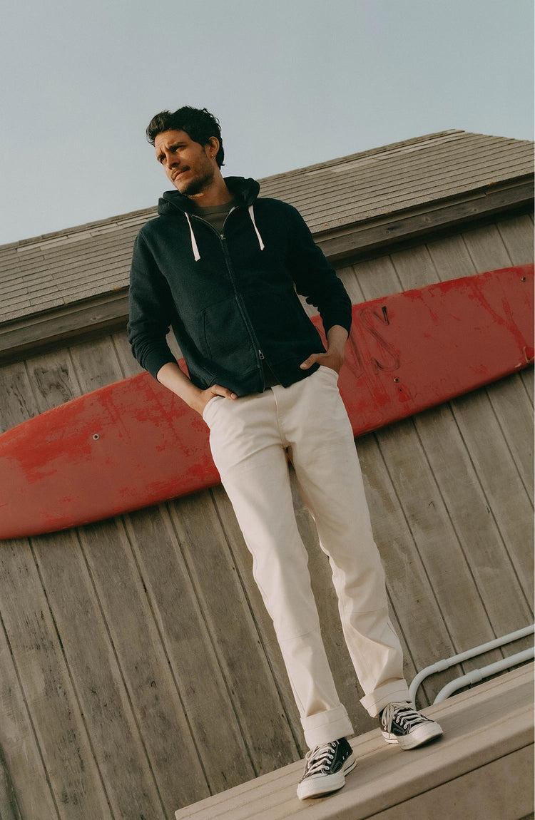 fit model posing in The Apres Zip Hoodie in Rinsed Indigo Terry