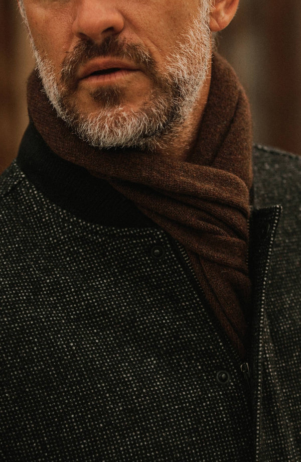 Close up of our model wearing a scarf under The Bomber Jacket in Charcoal Wool