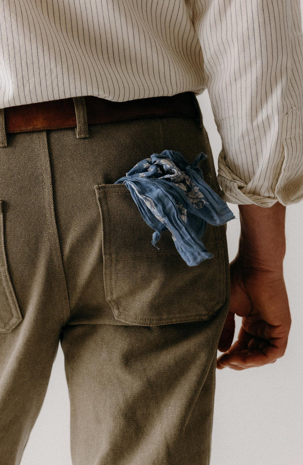fit model walking in The Camp Pant in Stone Chipped Canvas