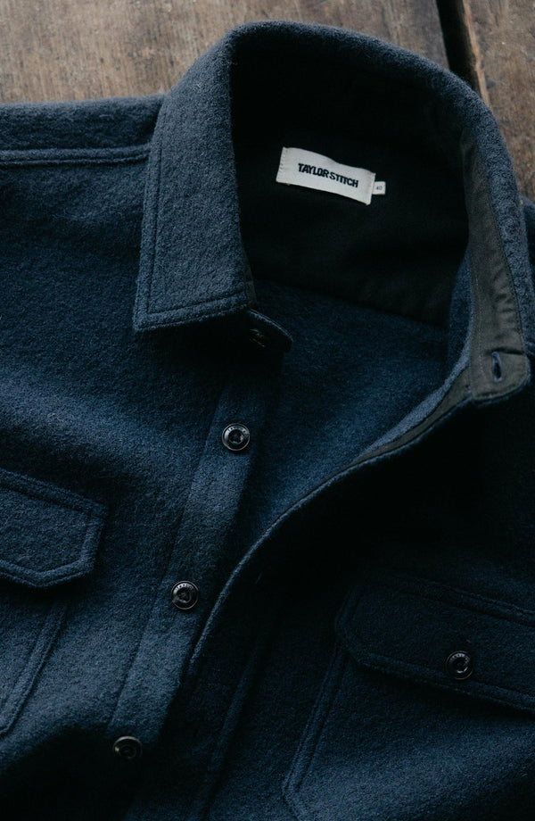 editorial image of The Connor Overshirt in Dark Navy Boucle hanging