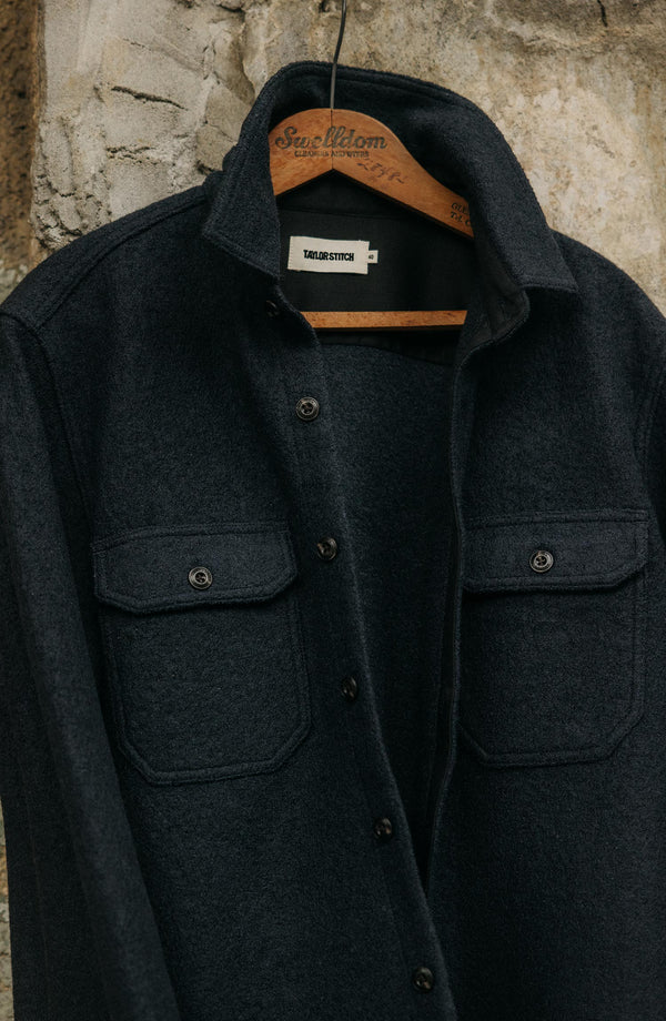 editorial image of The Connor Overshirt in Dark Navy Boucle hanging