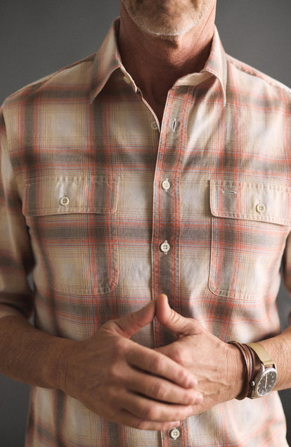 fit model showing off the buttons The Craftsman Shirt in Brick Shadow Plaid