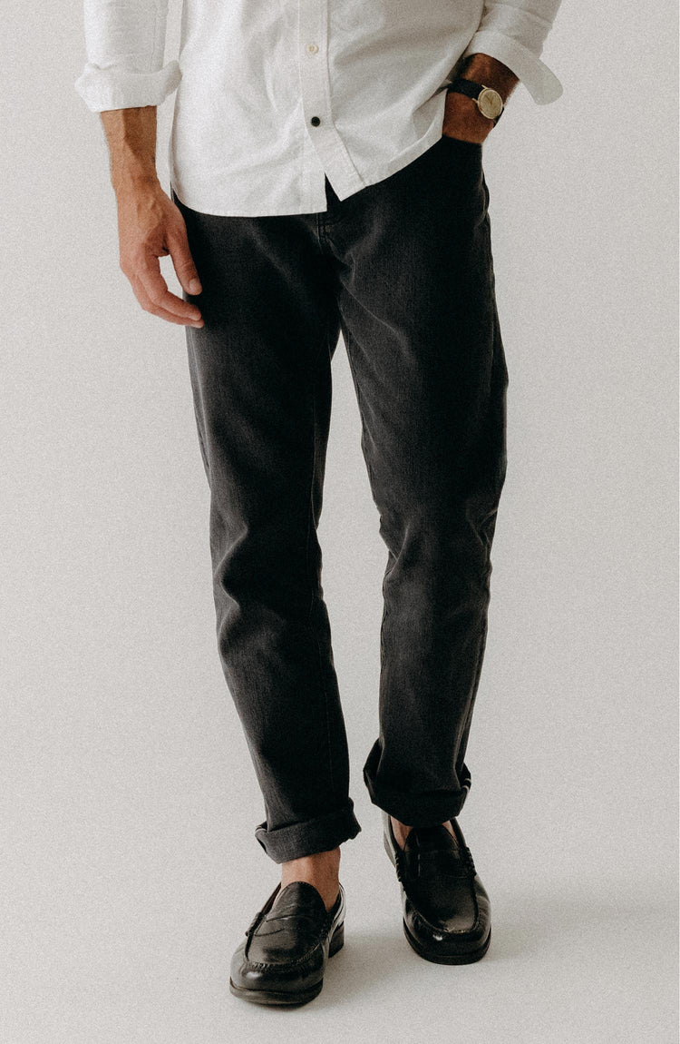 fit model posing in The Democratic Jean in Washed Black Organic Slub Selvedge