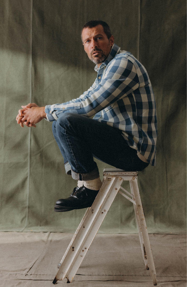 fit model walking wearing The Division Shirt in Washed Indigo Check