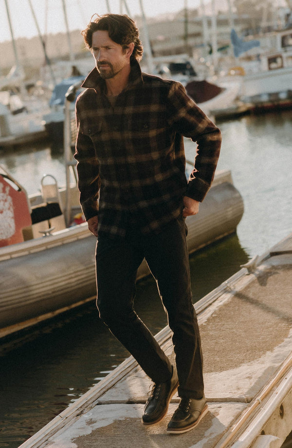 A pair of Foundation Pants folded on a black background.