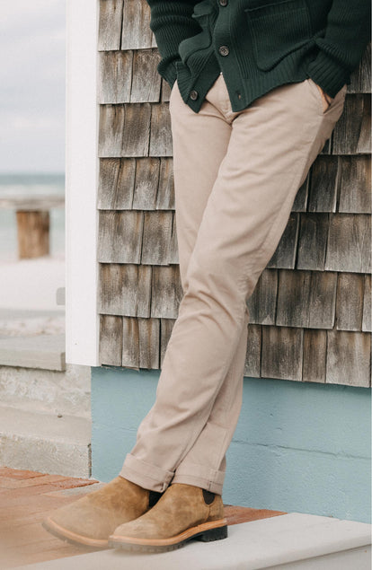 A pair of Foundation Pants folded on a black background.