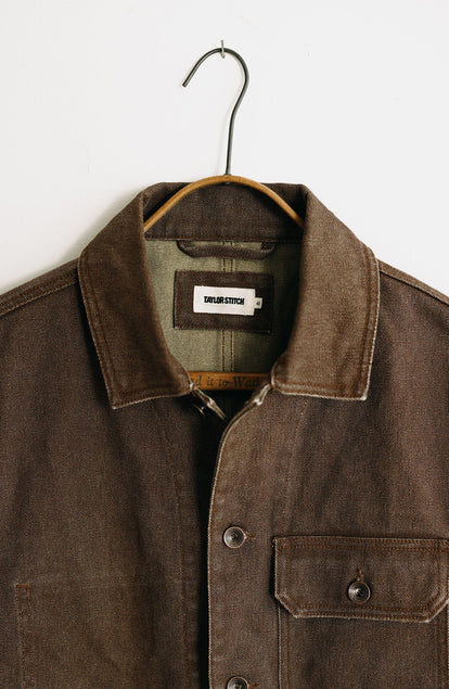 editorial image of The Fremont Jacket in Aged Penny Chipped Canvas on a hanger