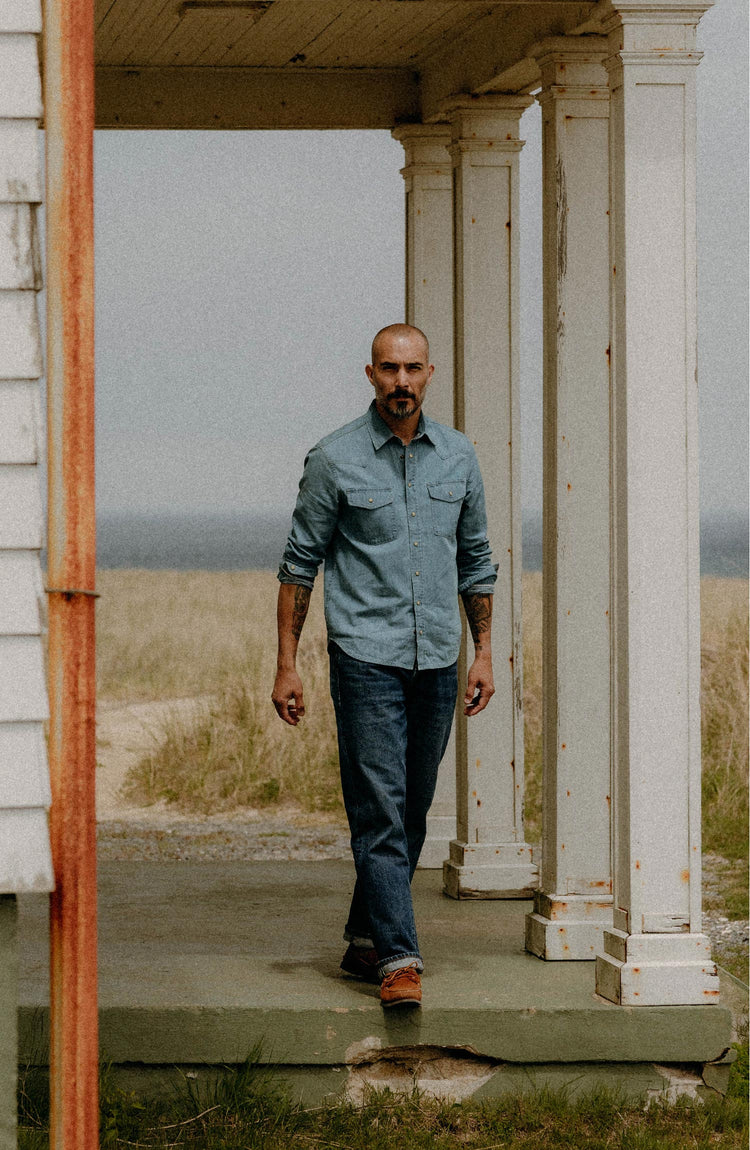 fit model walking wearing The Glacier Shirt in Washed Indigo Denim