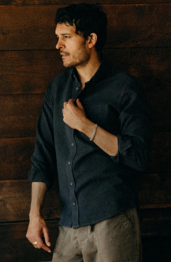 fit model leaning against the wall wearing The Jack in Coal Waffle