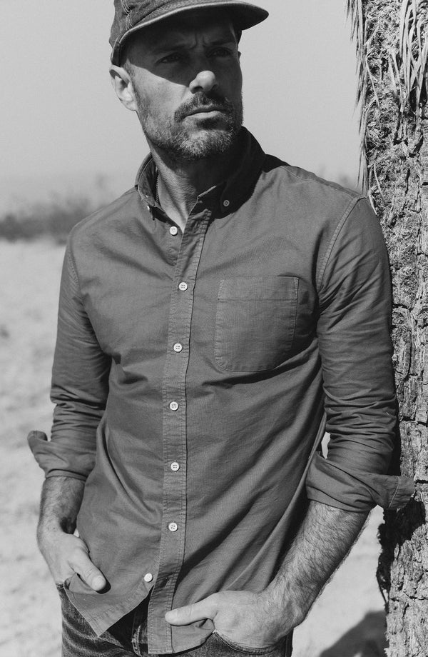 fit model leaning against a tree in The Jack in Smoke Oxford