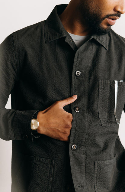 fit model showing off the buttons on The Ojai Jacket in Faded Black Seersucker