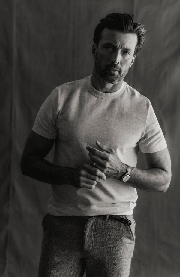 fit model sitting wearing The Organic Cotton Shop Tee in Oat Twist
