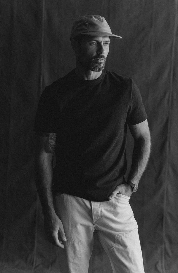 fit model walking wearing The Organic Cotton Shop Tee in Navy Twist