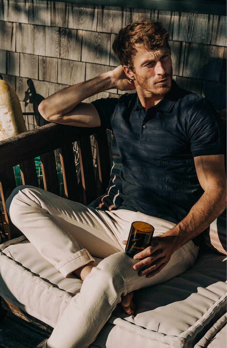 our guy wearing the polo—outside, near the coast in maine