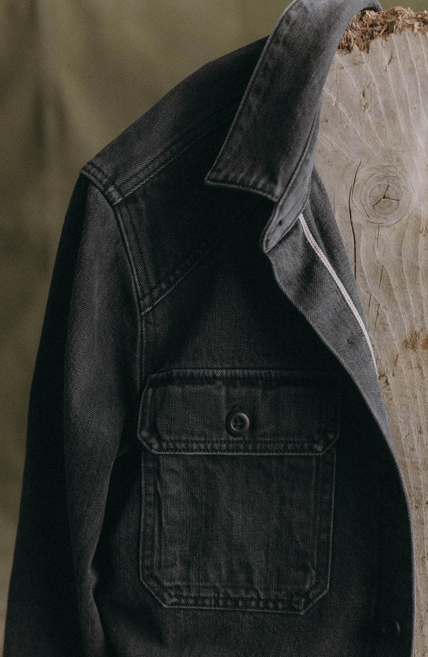 editorial image of The Shop Shirt in Washed Black Organic Slub Selvedge hanging on a board