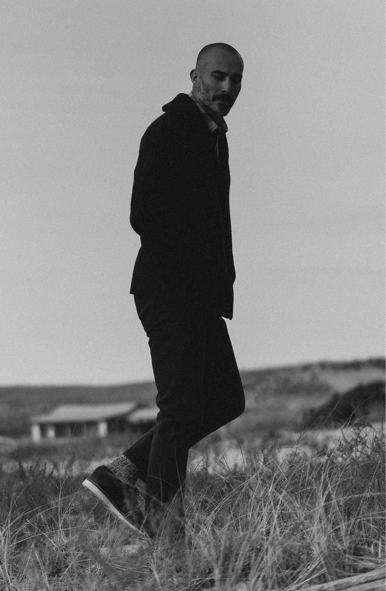 fit model walking wearing The Slim Jean in Washed Black Organic Slub Selvedge