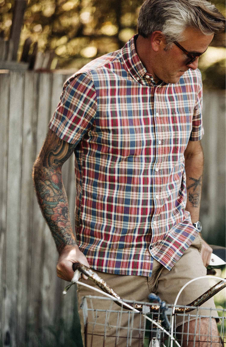 The Short Sleeve Jack in Red Madras — Model looking down while wearing shirt