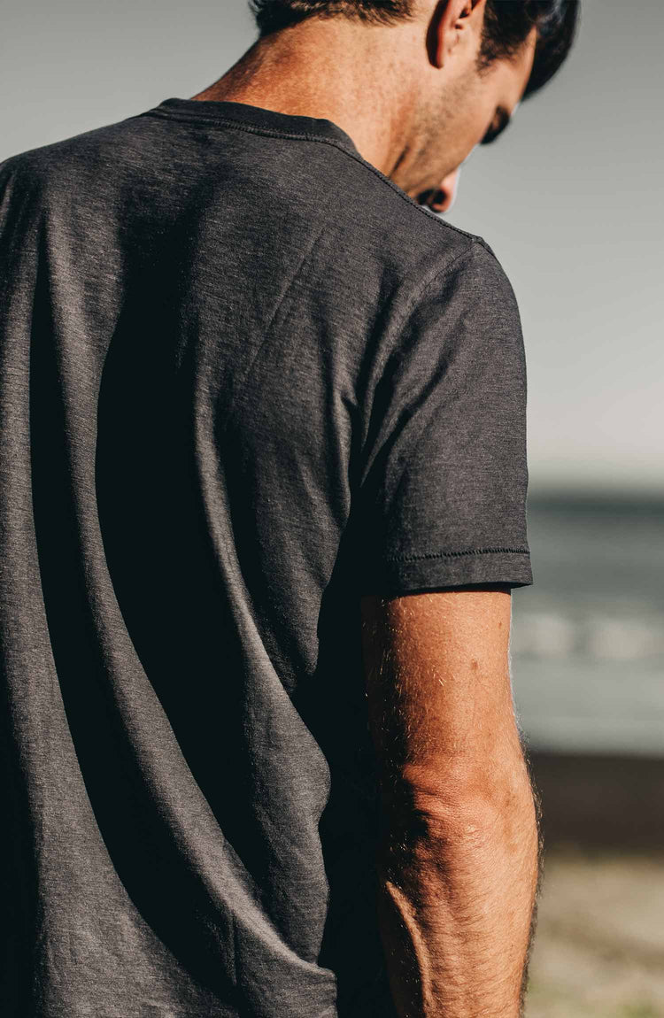 our cotton hemp tee in navy–worn on the beach