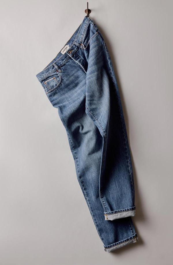 hanging image of The Straight Jean in Mid Wash Organic Selvedge