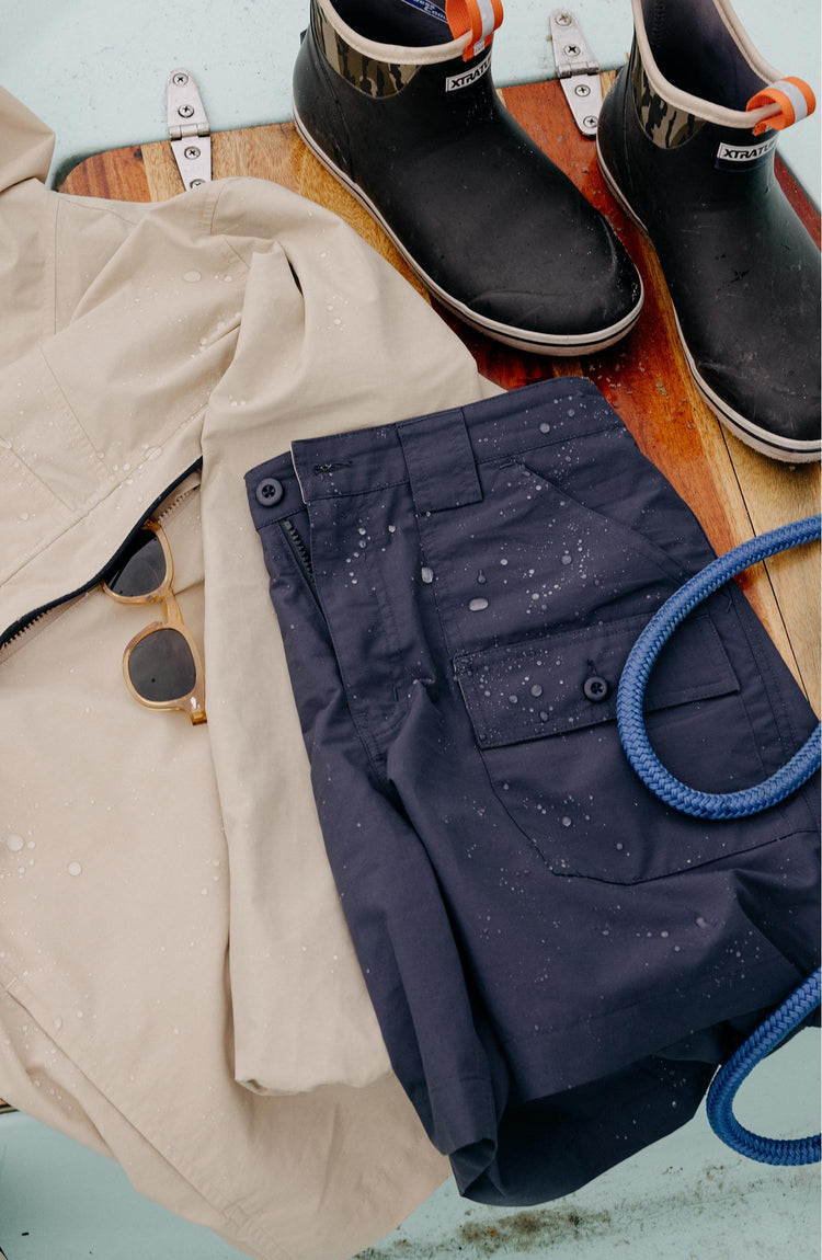 editorial image of The Trail Cargo Short in Faded Navy 60/40 Faille on a boat