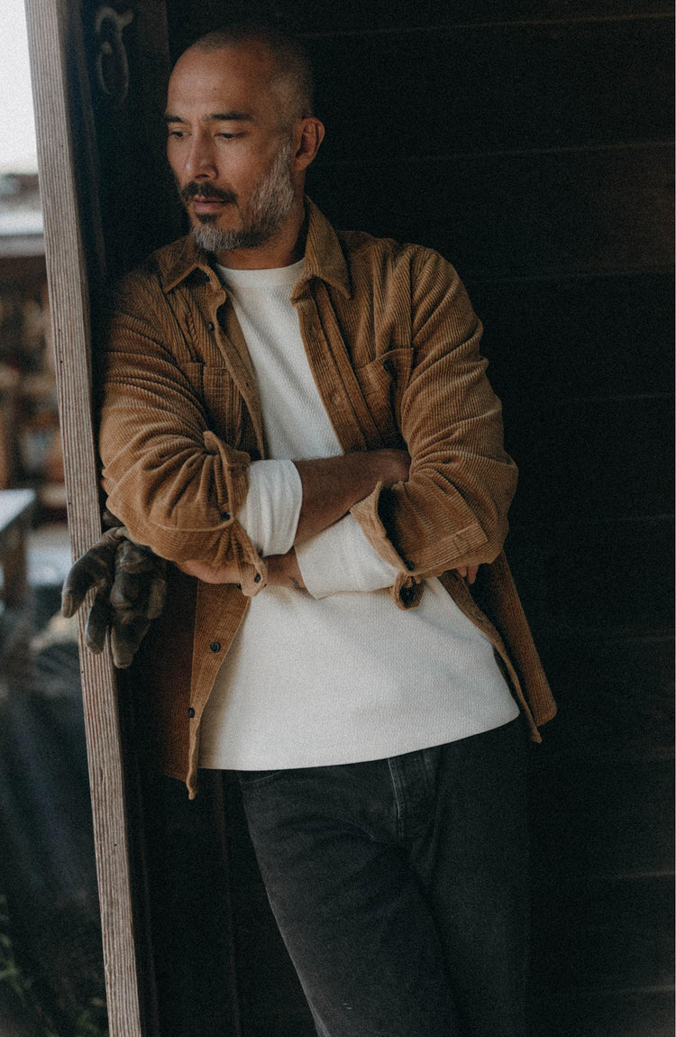 fit model leaning against the wall wearing The Utility Shirt in Bourbon Corduroy