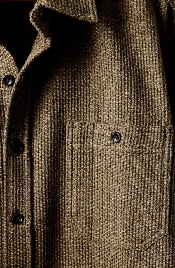 fit model with his arms crossed wearing The Utility Shirt in Cypress Sashiko