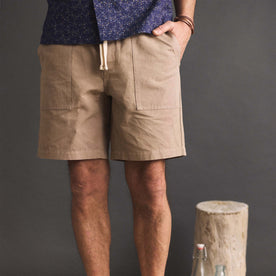 fit model with his hand in his pocket wearing The Apres Trail Short in Dried Earth Slub