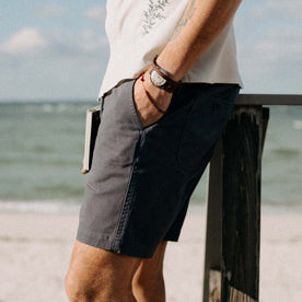 fit model with his hand in the pocket of The Apres Short in Organic Dark Blue Foundation Twill