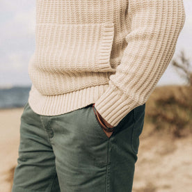 fit model showing off bottom hem of The Bryan Pullover Sweater in Flax Melange