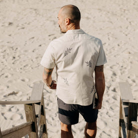 fit model showing off the back of The Conrad Shirt in Seaside Embroidery