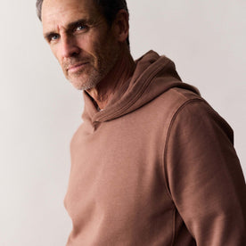 fit model showing the side of The Cotton Hemp Hoodie in Faded Brick