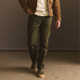 fit model walking in The Democratic Jean in Olive Nihon Menpu Selvage