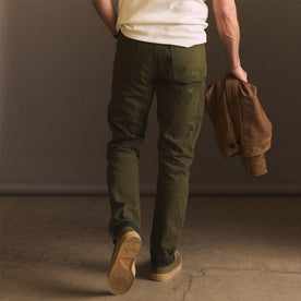 fit model showing off the back of The Democratic Jean in Olive Nihon Menpu Selvage