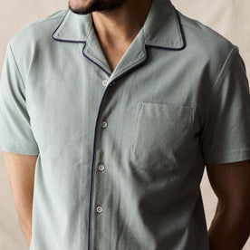 fit model showing off the buttons on The Harwich Shirt in Surf Green Tipped Pique