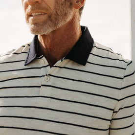 fit model showing off the collar on The Organic Cotton Polo in Bleached Natural Stripe