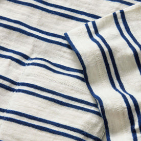 material shot of the sleeve and pocket on The Organic Cotton Tee in Washed Indigo Stripe