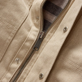 material shot of the YKK zipper on The Workhorse Utility Jacket in Light Khaki Chipped Canvas