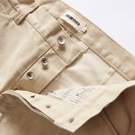 material shot of the button fly on The Camp Pant in Light Khaki Chipped Canvas