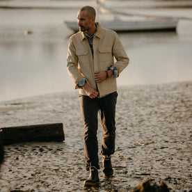 fit model walking in The Workhorse Utility Jacket in Light Khaki Chipped Canvas