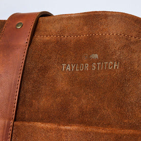 material shot of the branding on The Roughout Tote in Chocolate Suede